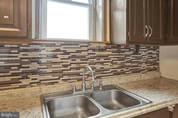 a close view of a sink and a mirror
