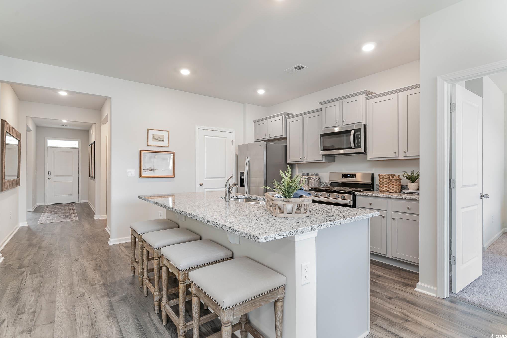 365 Rookroost Circle Conway, SC 29526 - Photo 5 of 21 Kitchen featuring gray cabinetry, light stone coun