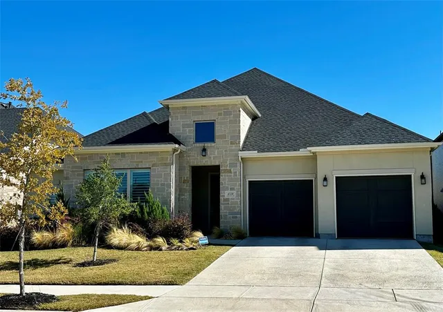 a front view of a house with yard