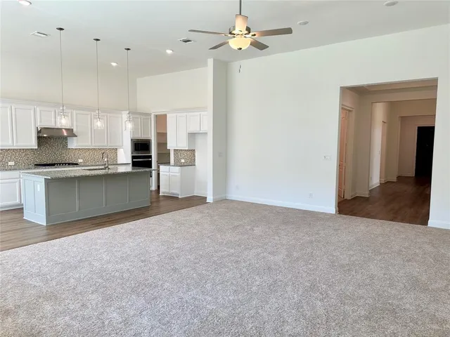 a view of a kitchen with a sink and a kitchen