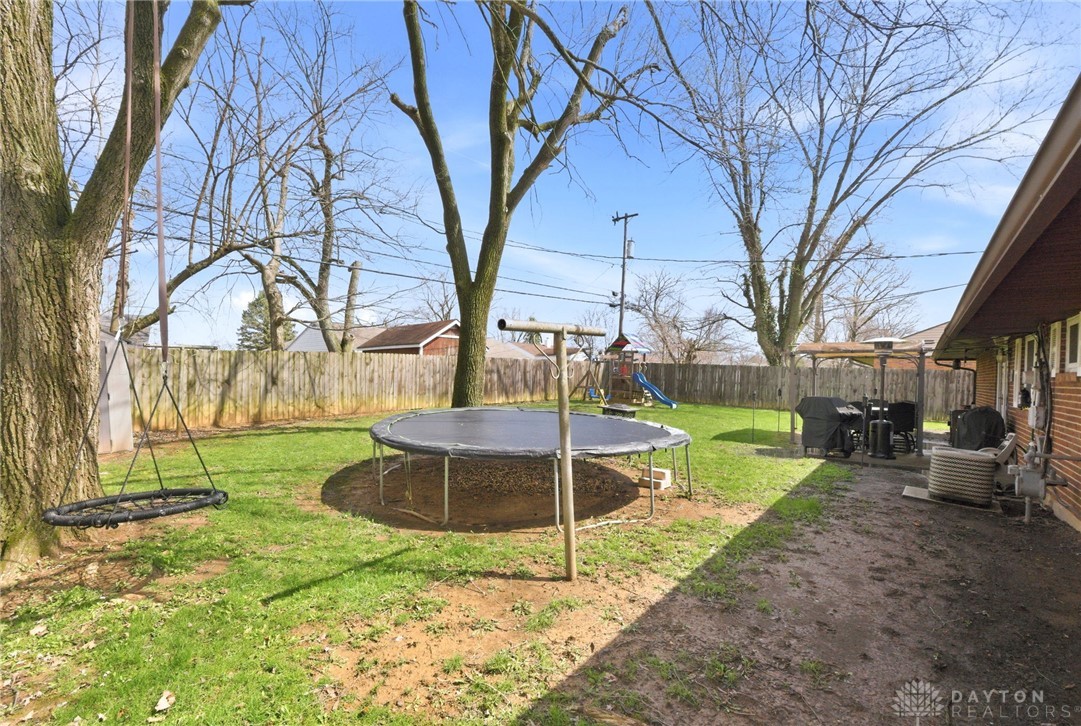 5171 Fishburg Road Dayton, OH 45424 - Photo 34 of 35 This spacious yard offers a perfect canvas for outdoor recreation and relaxation.