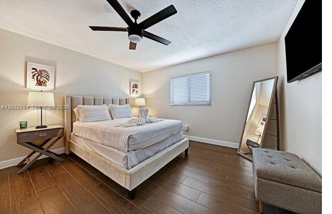 945 Sunset Road, Unit 1 West Palm Beach, FL 33401 - Photo 12 of 20 a bedroom with a bed couch and a window