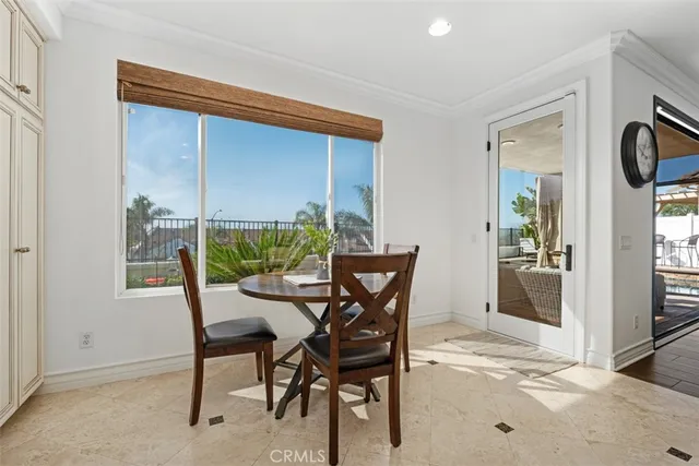 a view of a dining room with furniture and window