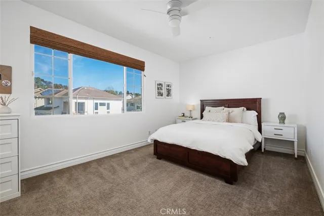 a bathroom with a sink double vanity granite tub shower and a mirror