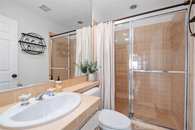a living room with furniture fireplace and a large window