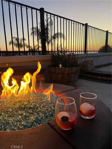 a view of a chairs and table in backyard