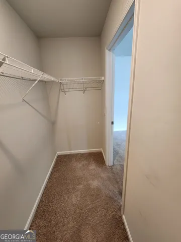 a view of an empty walk in closet