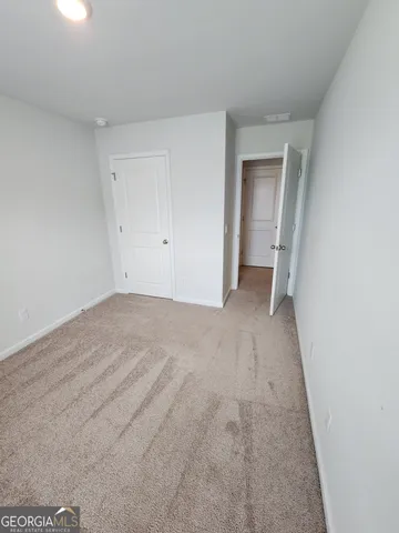 a view of room with window and stairs