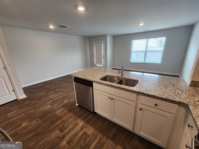 a kitchen with sink and window