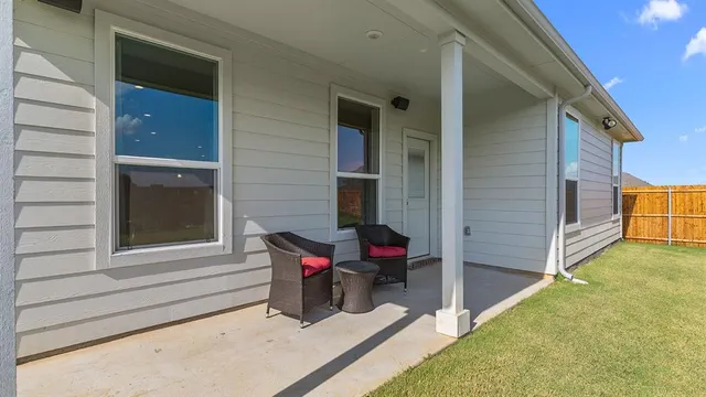 a view of a house with pool and porch
