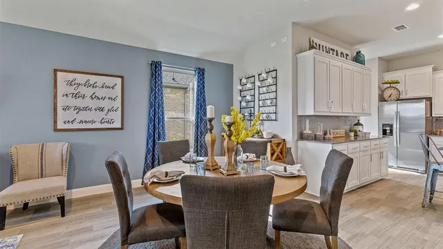 a kitchen with stainless steel appliances granite countertop refrigerator sink and cabinets