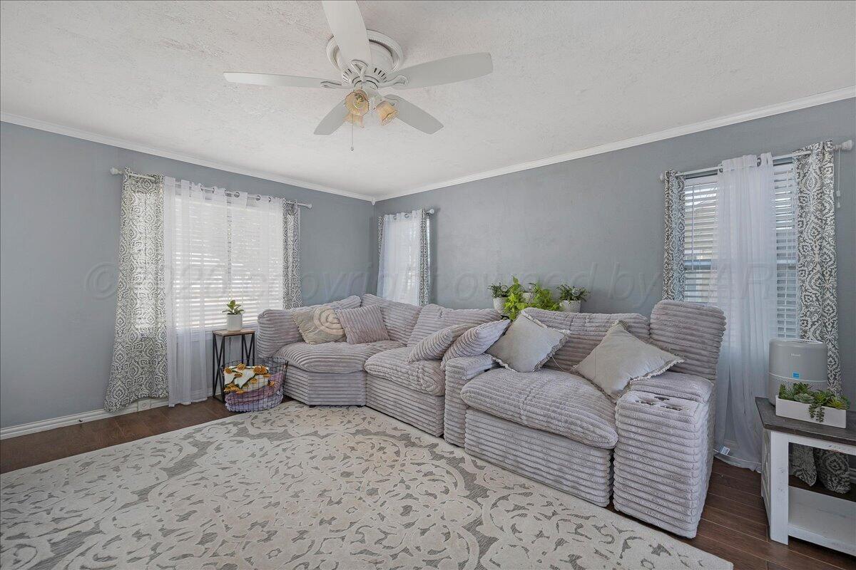 4011 Parker Street Amarillo, TX 79110 - Photo 3 of 17 a living room with furniture and a large window