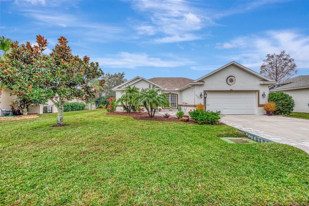 5856 Wilson Road Venice, FL 34293 - Photo 1 of 1 a front view of a house with garden