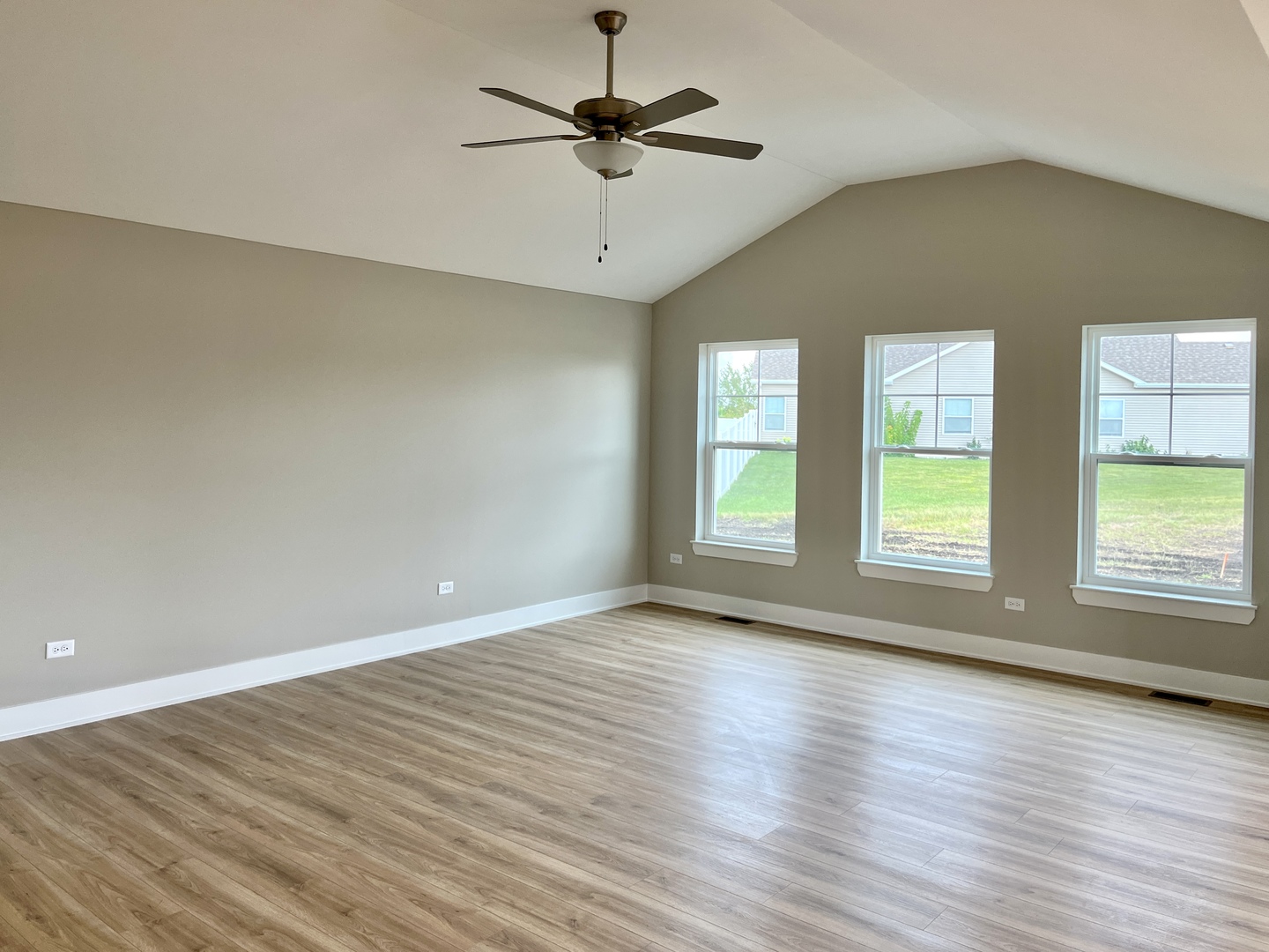 5541 Old Manor Road Bourbonnais, IL 60914 - Photo 4 of 9 an empty room with wooden floor and windows