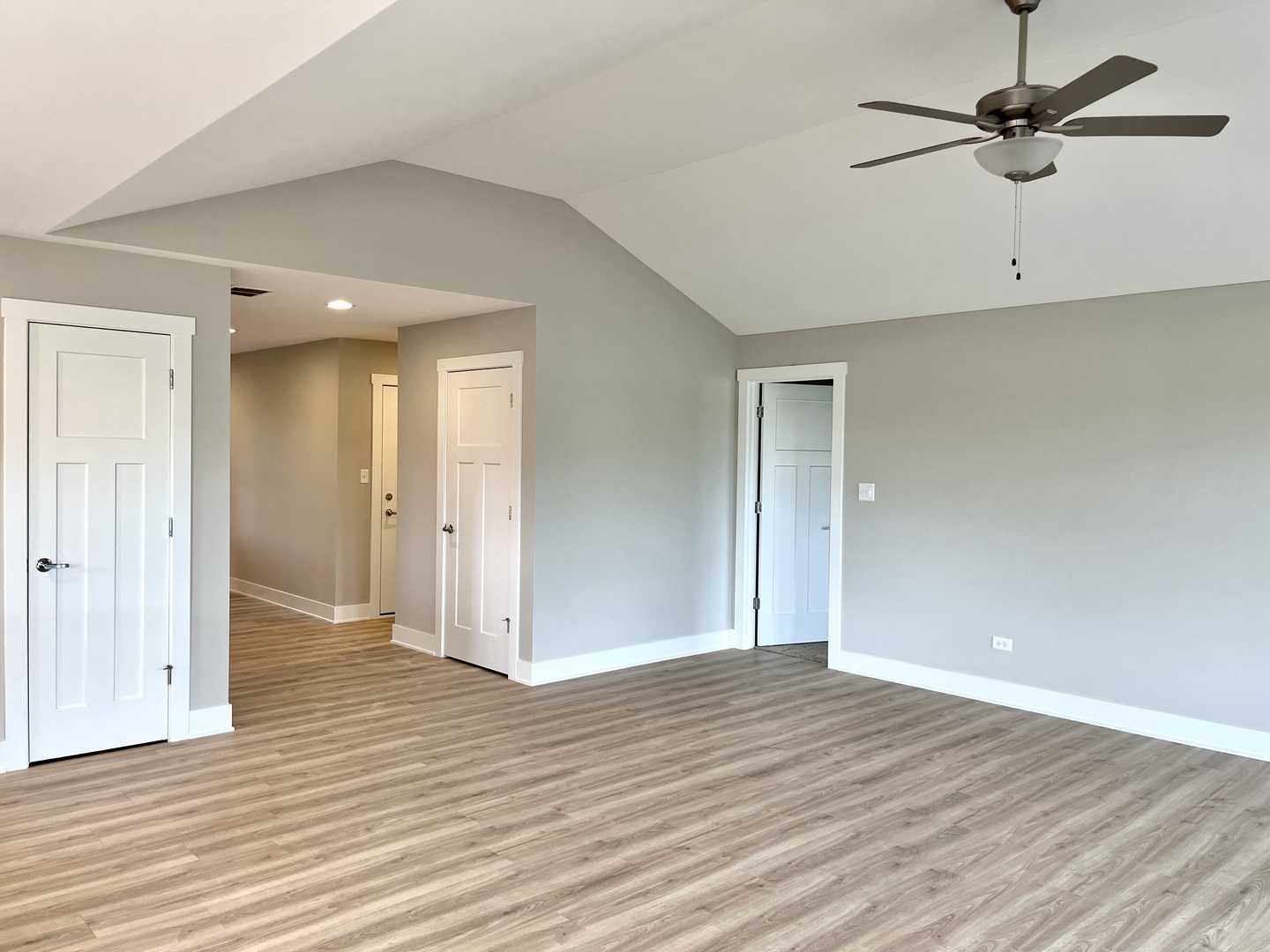 5541 Old Manor Road Bourbonnais, IL 60914 - Photo 5 of 9 an empty room with wooden floor and ceiling fan