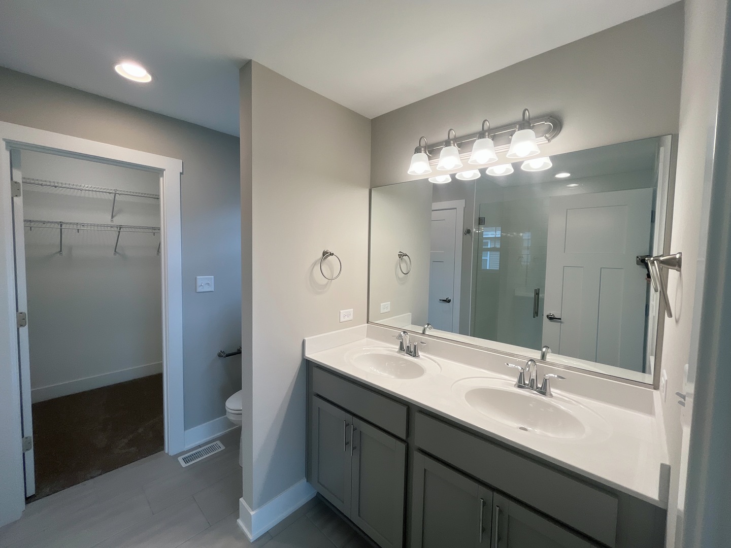 5541 Old Manor Road Bourbonnais, IL 60914 - Photo 9 of 9 a bathroom with a double vanity sink mirror and toilet