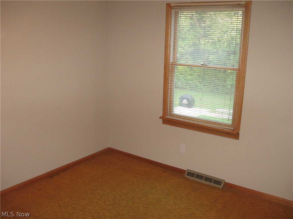 9020 Diagonal Road Streetsboro, OH 44241 - Photo 8 of 26 Bedroom 2 features neutral decor, windows for natural light and double closet space.