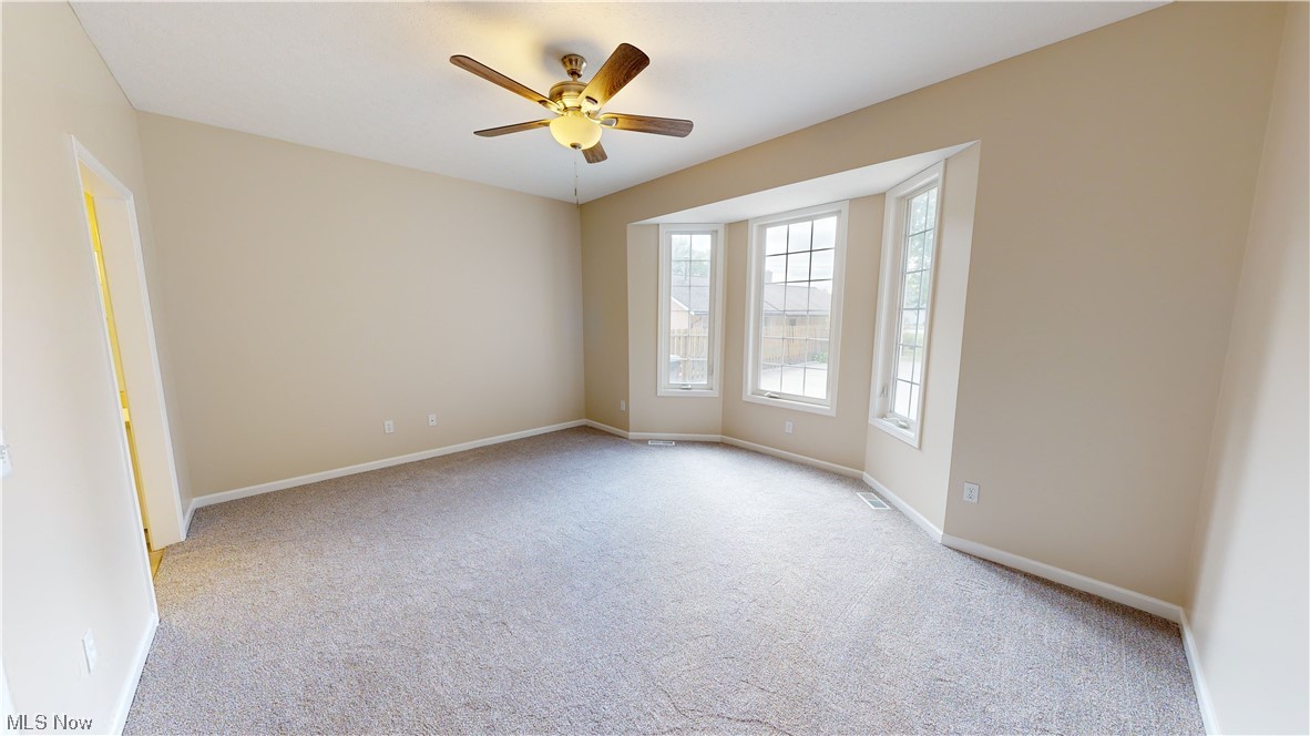 8325 Munson Road Mentor, OH 44060 - Photo 20 of 35 Carpeted spare room with ceiling fan