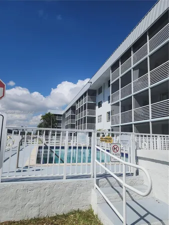 a front view of a building with a fountain