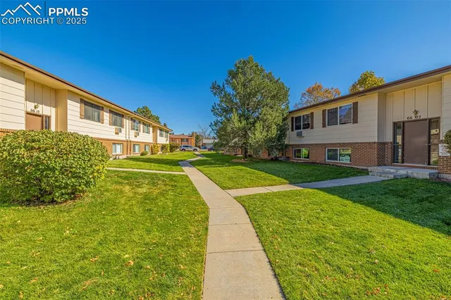 a view of house with swimming pool