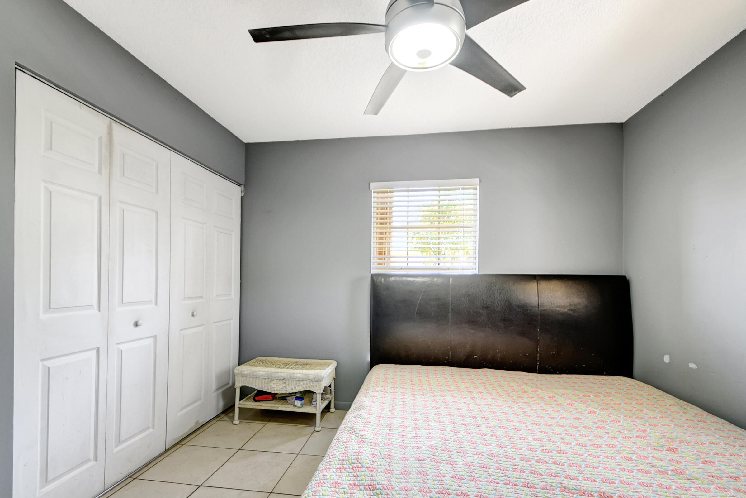 10128 Boynton Pl Circle Boynton Beach, FL 33437 - Photo 15 of 25 a bedroom with a bed and a window