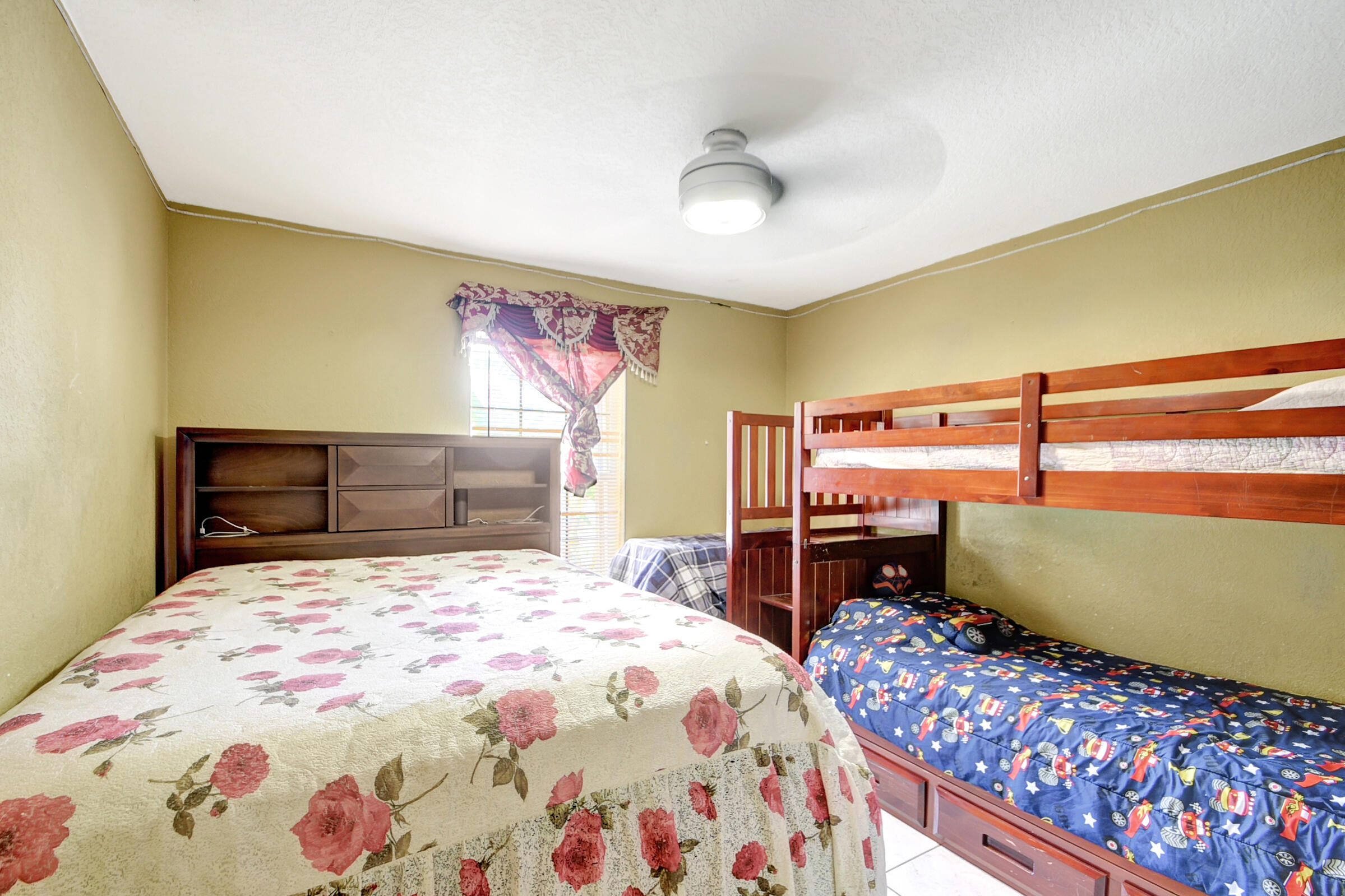 10128 Boynton Pl Circle Boynton Beach, FL 33437 - Photo 18 of 25 a bedroom with a bed and a dresser