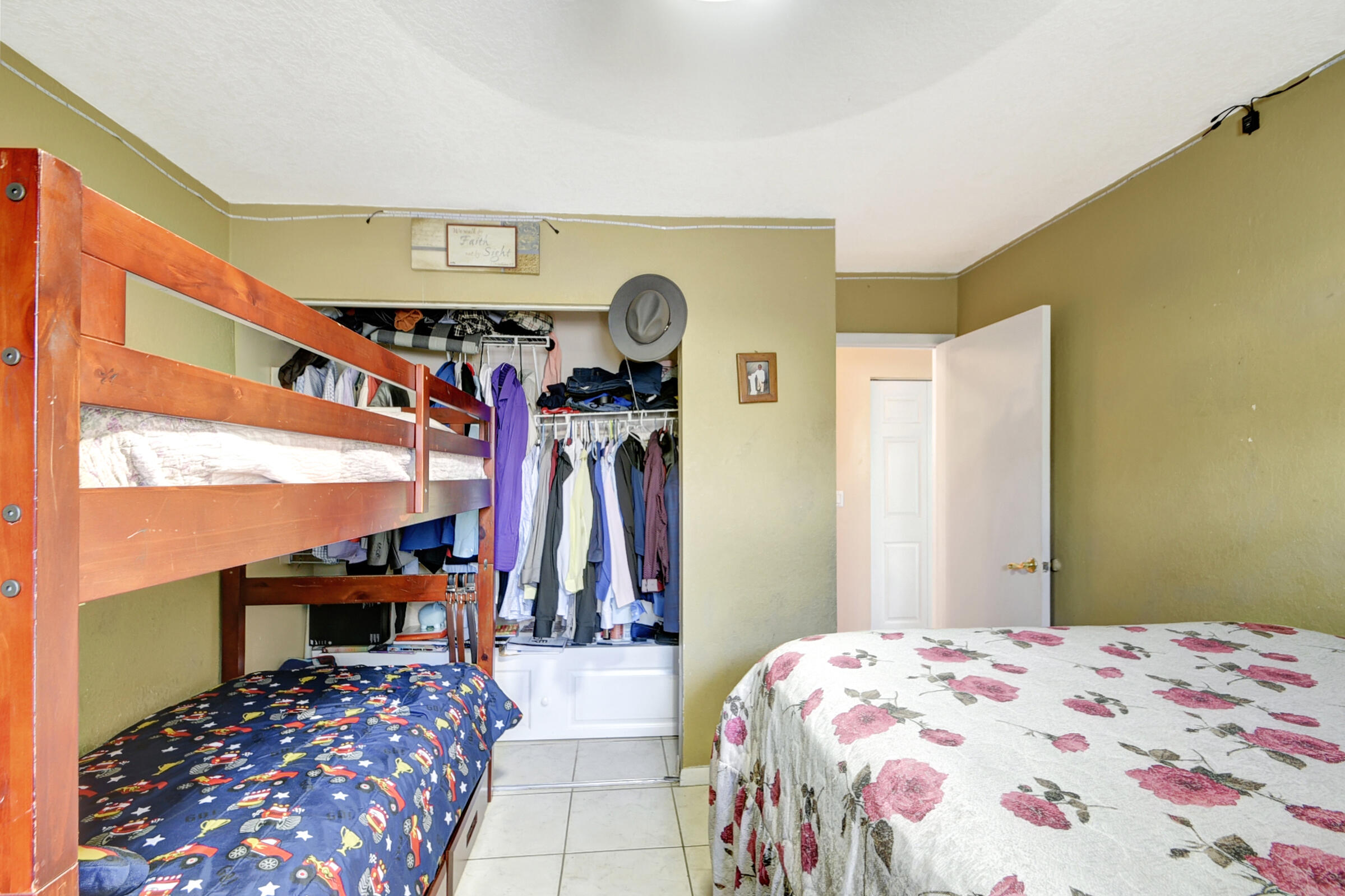 10128 Boynton Pl Circle Boynton Beach, FL 33437 - Photo 19 of 25 a bed room with a bed and a chair