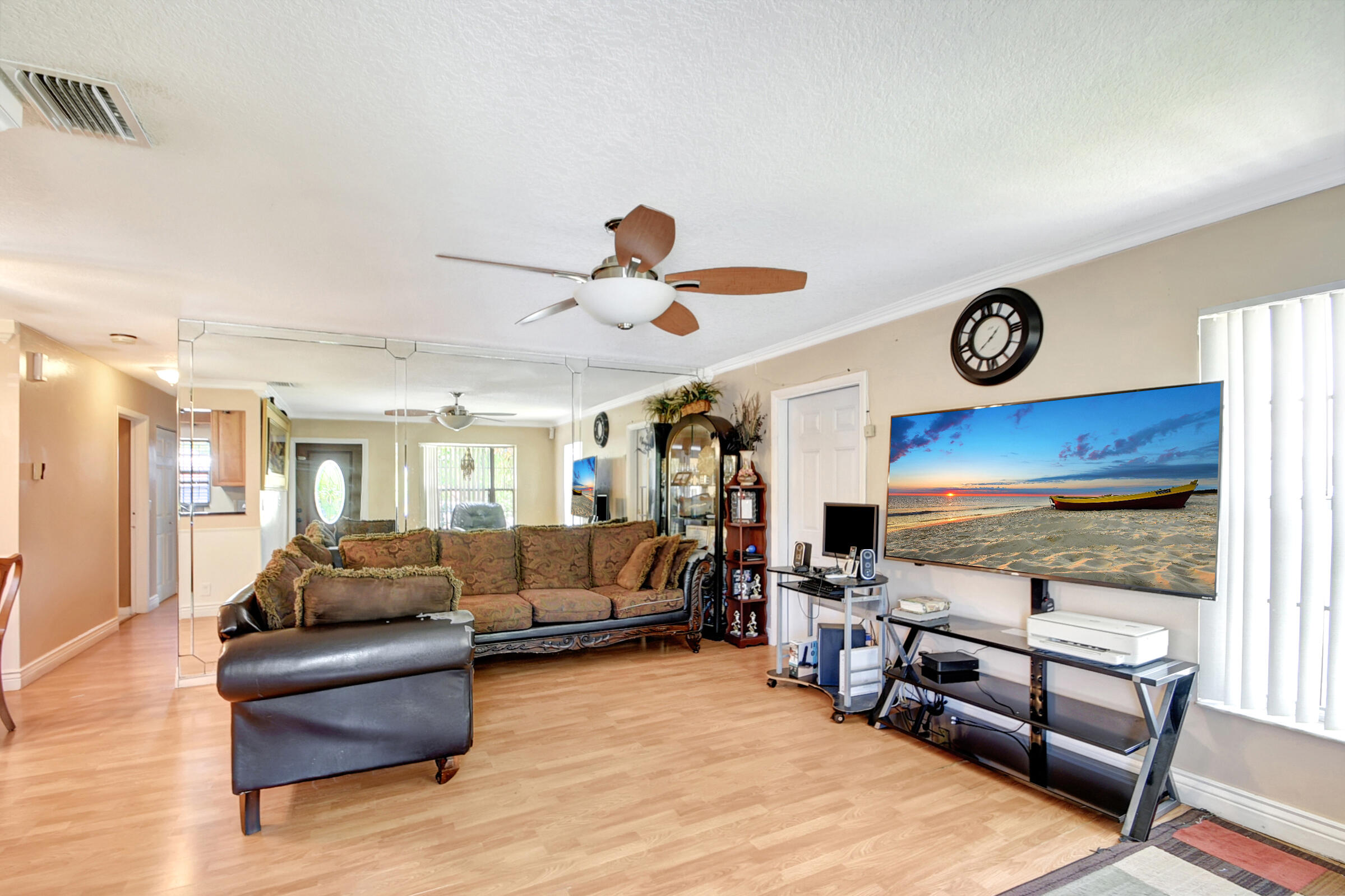 10128 Boynton Pl Circle Boynton Beach, FL 33437 - Photo 3 of 25 a living room with furniture and a flat screen tv