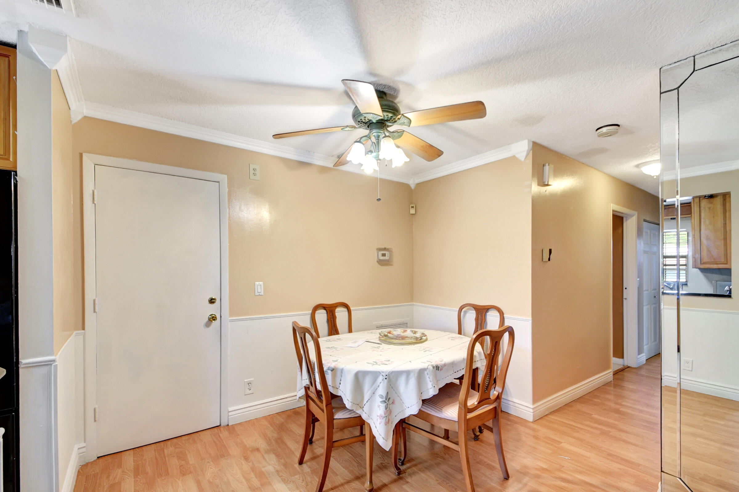 10128 Boynton Pl Circle Boynton Beach, FL 33437 - Photo 5 of 25 a view of a dining room with furniture and a chandelier fan