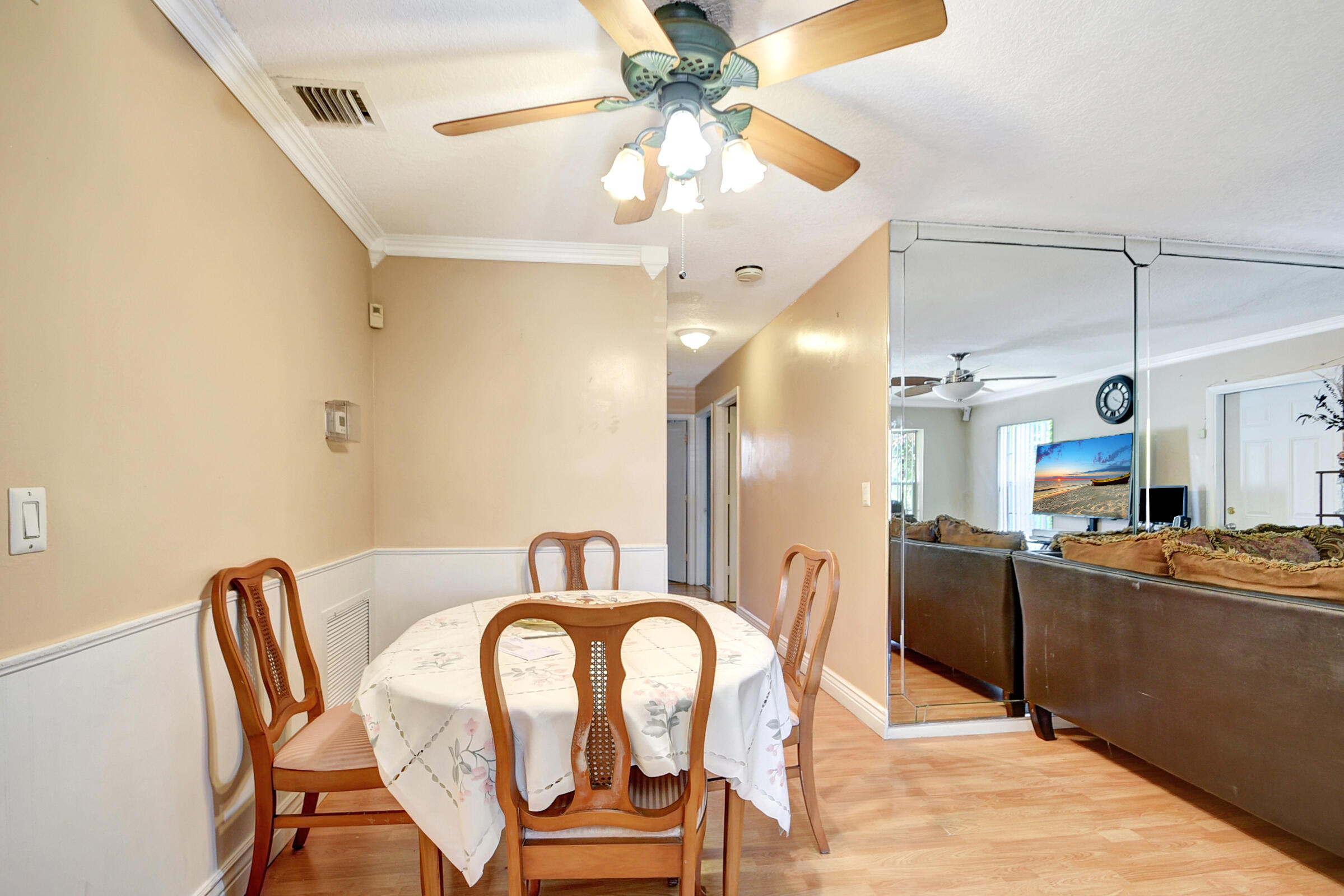 10128 Boynton Pl Circle Boynton Beach, FL 33437 - Photo 6 of 25 a dining room with furniture and a chandelier