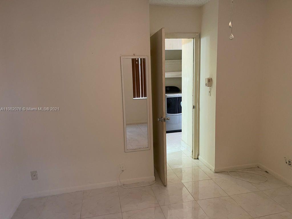 6449 Pinehurst Circle, Unit C25 Tamarac, FL 33321 - Photo 3 of 22 an empty room with windows