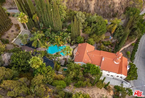 a view of entryway with wooden floor and front door