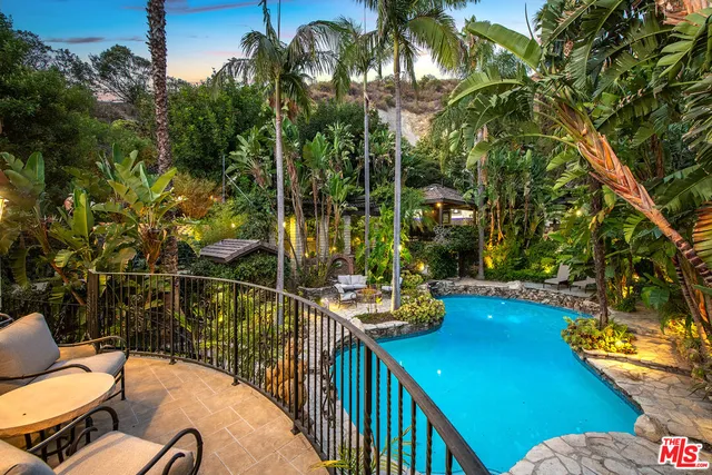 a view of a balcony with chairs