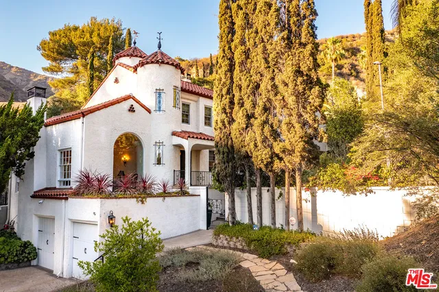 a view of a chairs and a table in the balcony