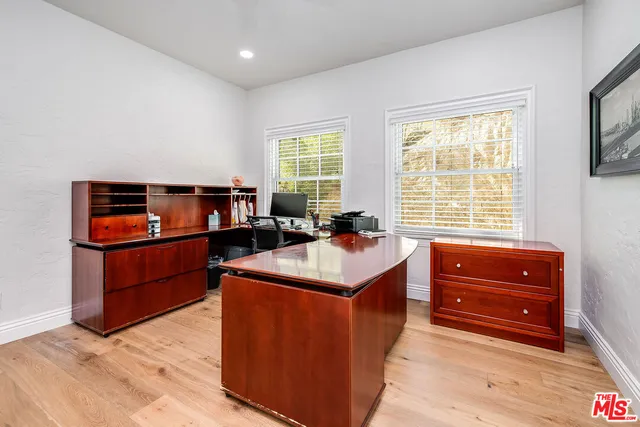 a view of a hardwood floor and a window