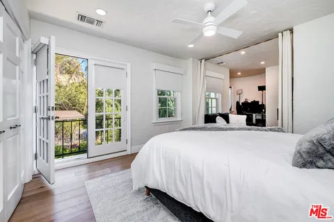 a view of a swimming pool with a yard and sitting area