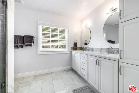 a view of a backyard with sitting area