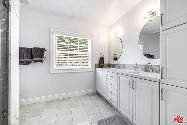 a view of a backyard with sitting area