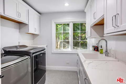 a view of a couch in the back yard of a house