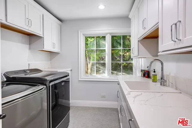 a view of a couch in the back yard of a house