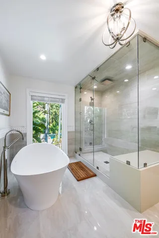 a view of backyard with swimming pool and sitting area