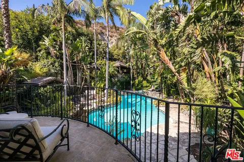a picture of a bathroom with a sink and mirror