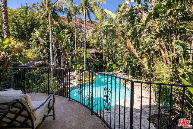a picture of a bathroom with a sink and mirror
