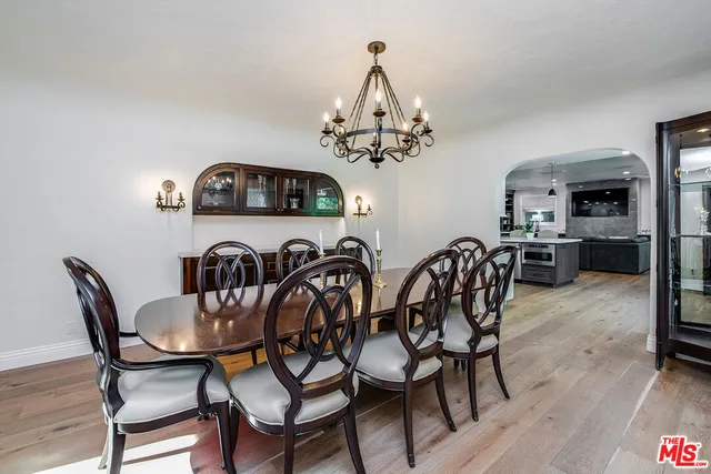 a spacious bedroom with a bed and a large window