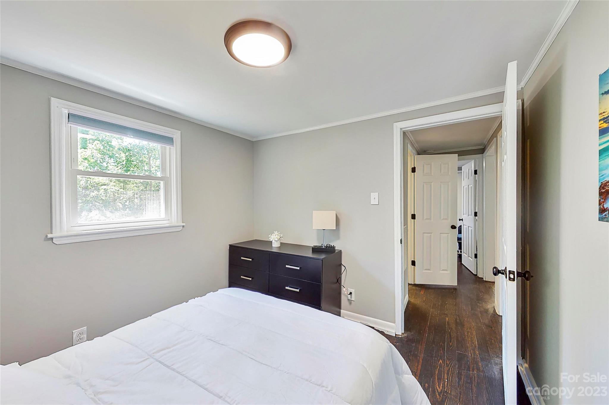 4325 Dobys Bridge Road Fort Mill, SC 29707 - Photo 8 of 11 a bedroom with a bed and a dresser