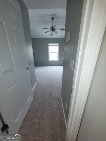 a view of entryway and hallway with a window