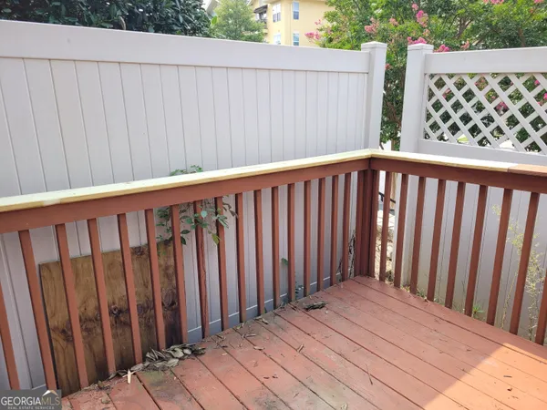 a balcony with wooden floor