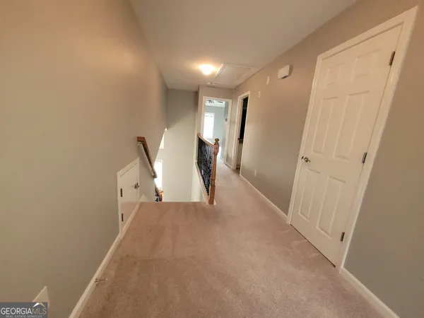 a view of a hallway with entryway