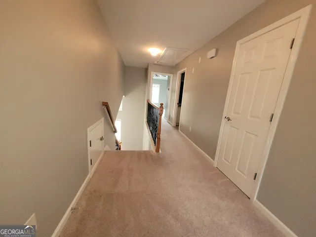 a view of a hallway with entryway