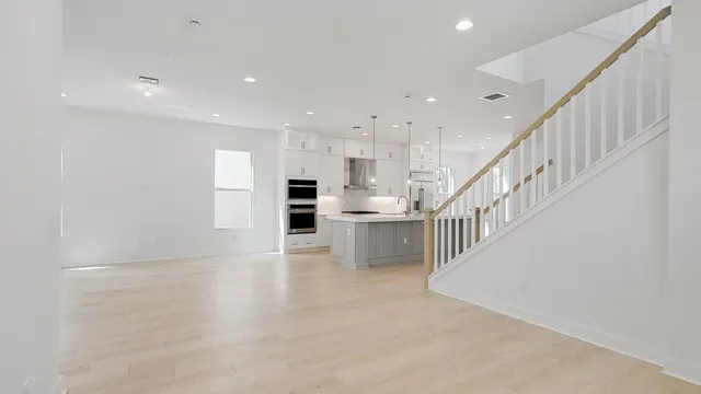 a view of kitchen with furniture and refrigerator